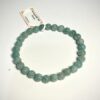 Bracelet en 6 mm en Amazonite posé sur fond blanc