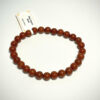 Bracelet en 6 mm en Jaspe rouge posé sur fond blanc