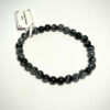 Bracelet en 6 mm en Obsidienne neige posé sur fond blanc