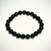 Bracelet en 8 mm en Obsidienne noire posé sur fond blanc