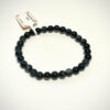 Bracelet en 8 mm en Oeil de Faucon sur fond blanc