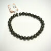 Bracelet en 6 mm en Pyrite posé sur fond blanc